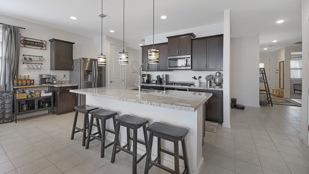 Modern kitchen with stainless steel appliances and a large island